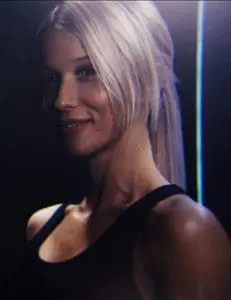 Female in Black Box Virtual Reality Gym finishing her workout experience